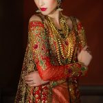 Buy this heavily embroidered elegant Pakistani designer wear by pakistani fashion designer Tena Durrani